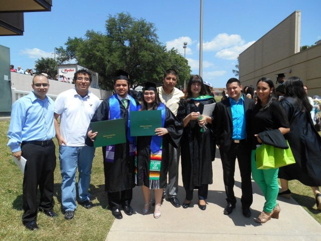 Students and Parents Posing after Graduation